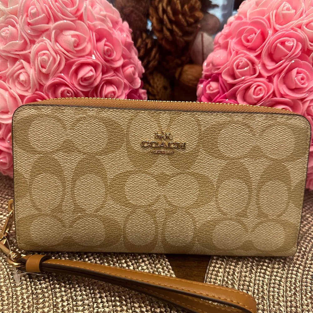 Coach Tan Textured Canvas wristlet with Signature Design